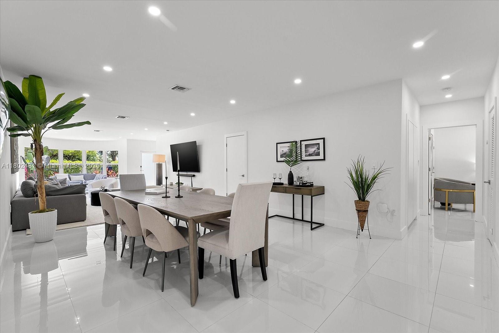 3020 Alton Road Miami Beach, FL 33140 - Photo 11 of 40 a view of a dining room with furniture