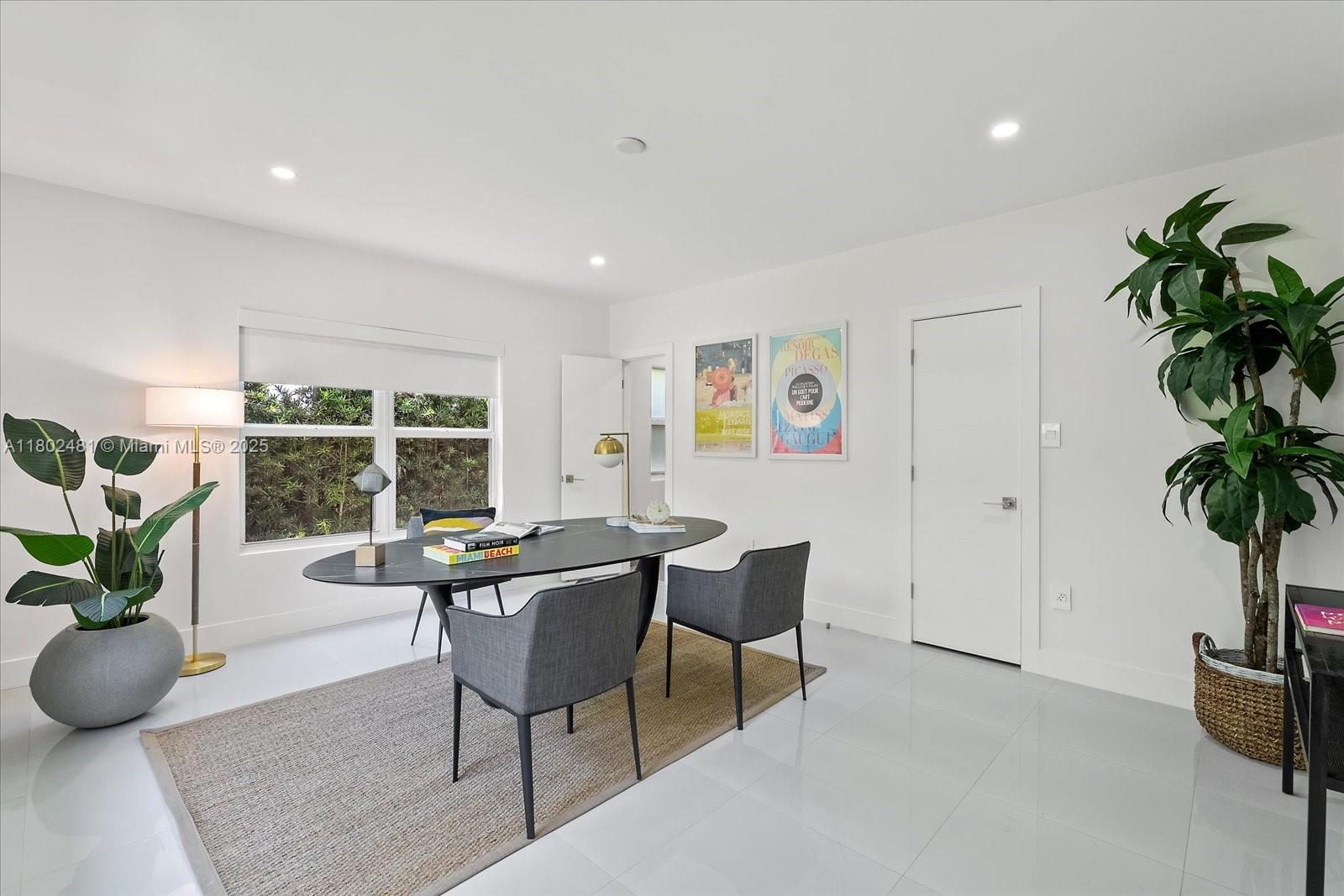 3020 Alton Road Miami Beach, FL 33140 - Photo 20 of 40 a view of a dining room with furniture window and outside view
