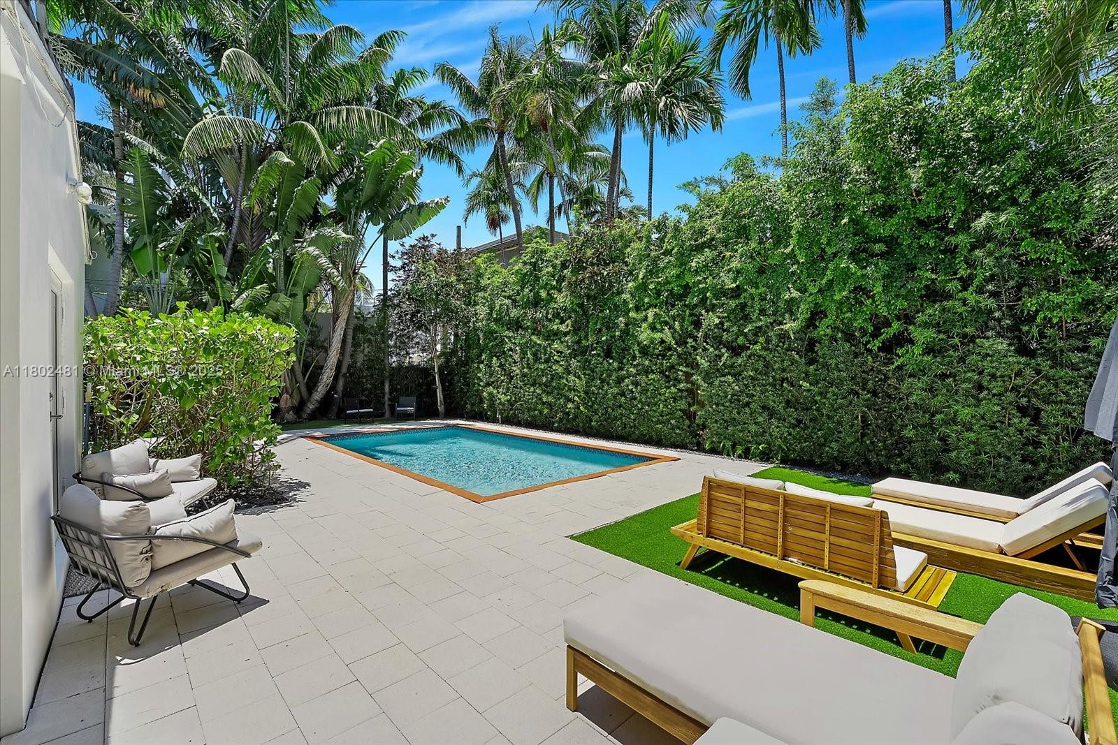 3020 Alton Road Miami Beach, FL 33140 - Photo 32 of 40 a view of a backyard with plants