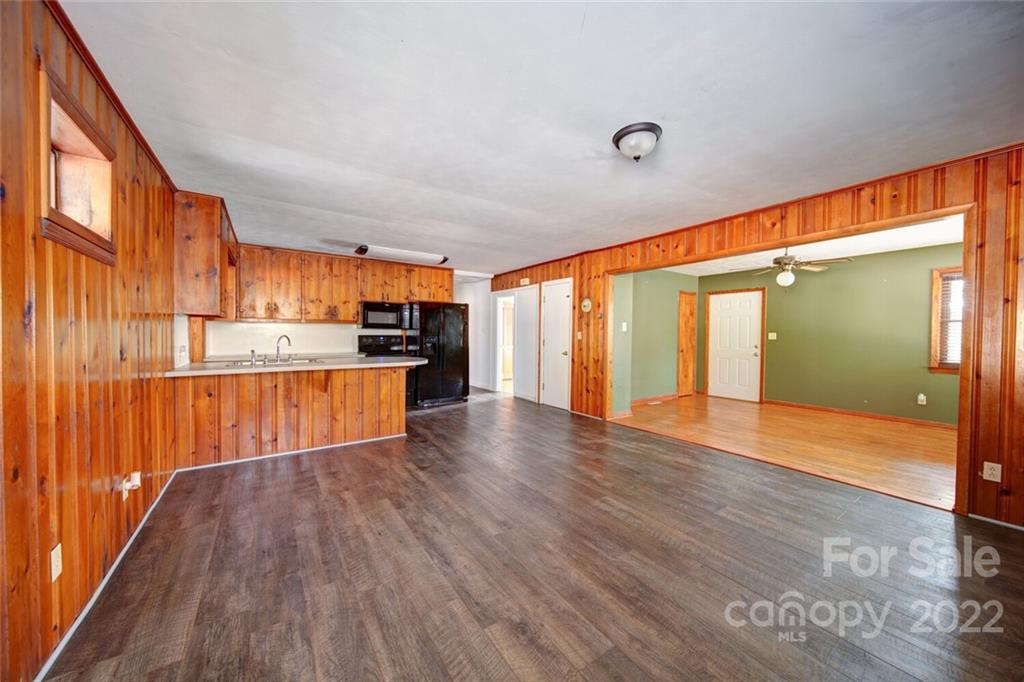 7218 Hills-View Road Oakboro, NC 28129 - Photo 8 of 27 a view of kitchen with wooden floor and electronic appliances
