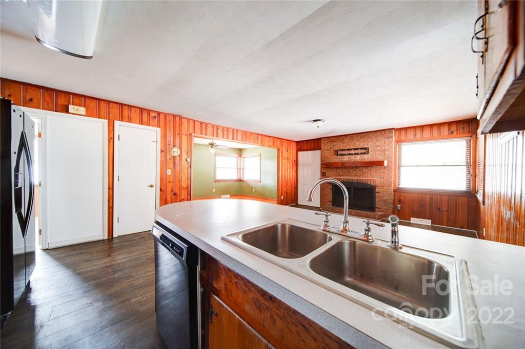 7218 Hills-View Road Oakboro, NC 28129 - Photo 10 of 27 a kitchen with a sink and a large window