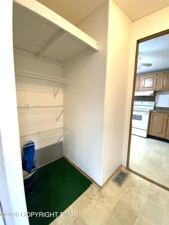 a spacious bathroom with a sink a mirror and a shower