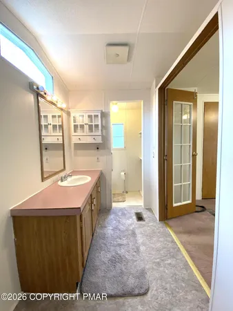 a view of a hallway with staircase