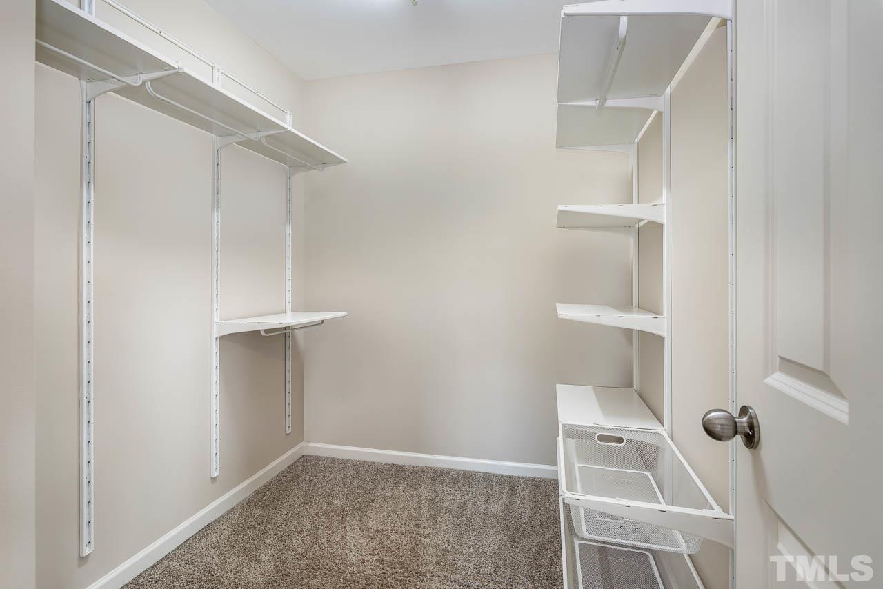 421 Provincial Street Raleigh, NC 27603 - Photo 13 of 22 a view of walk in closet with empty racks