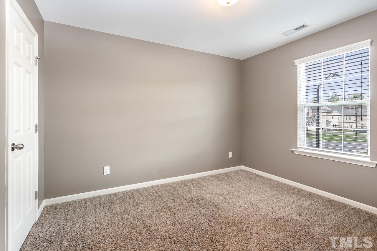 421 Provincial Street Raleigh, NC 27603 - Photo 14 of 22 an empty room with a window