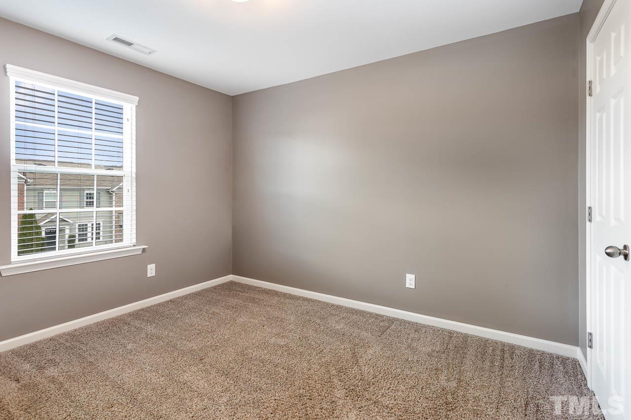 421 Provincial Street Raleigh, NC 27603 - Photo 15 of 22 a view of an empty room with a window