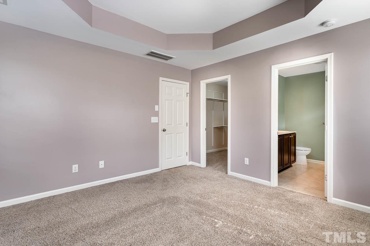 421 Provincial Street Raleigh, NC 27603 - Photo 9 of 22 an empty room with closet and a bathroom