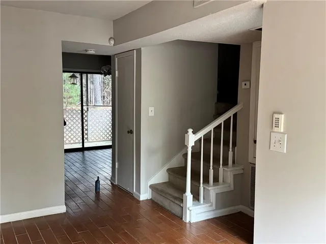 a view of entryway with wooden floor
