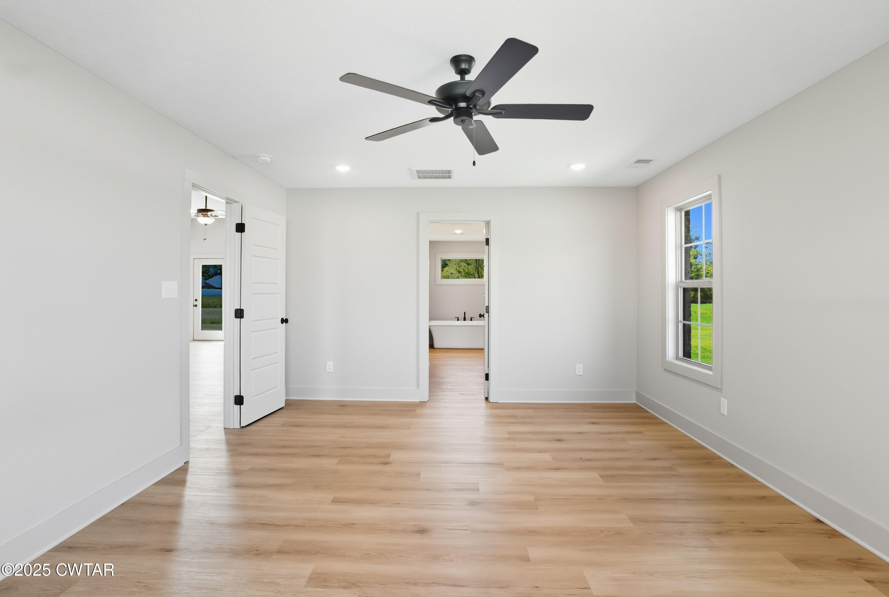 170 Daybreak Loop Medina, TN 38355 - Photo 15 of 31 wooden floor in an empty room with a window