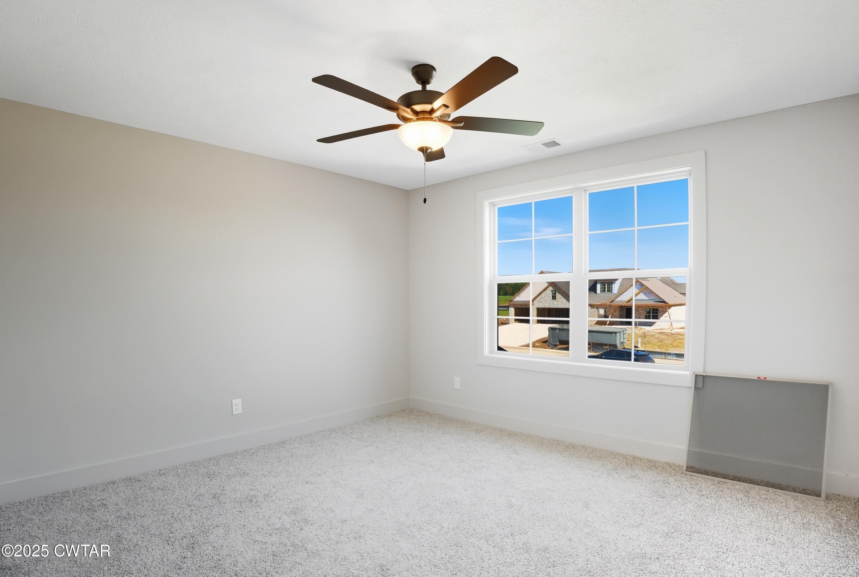 170 Daybreak Loop Medina, TN 38355 - Photo 20 of 31 an empty room with window and ceiling fan