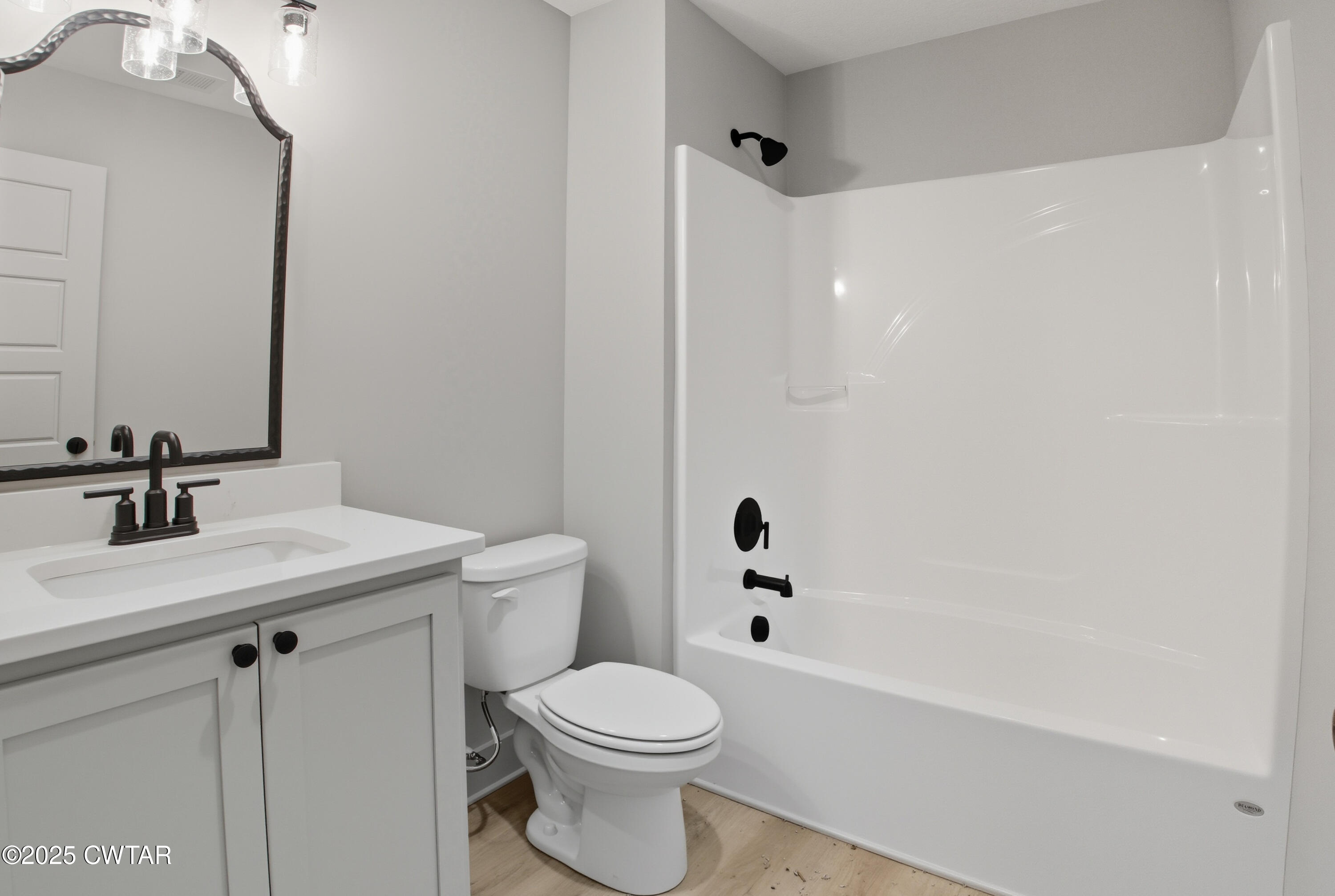 170 Daybreak Loop Medina, TN 38355 - Photo 21 of 31 a bathroom with a sink a toilet and a bathtub