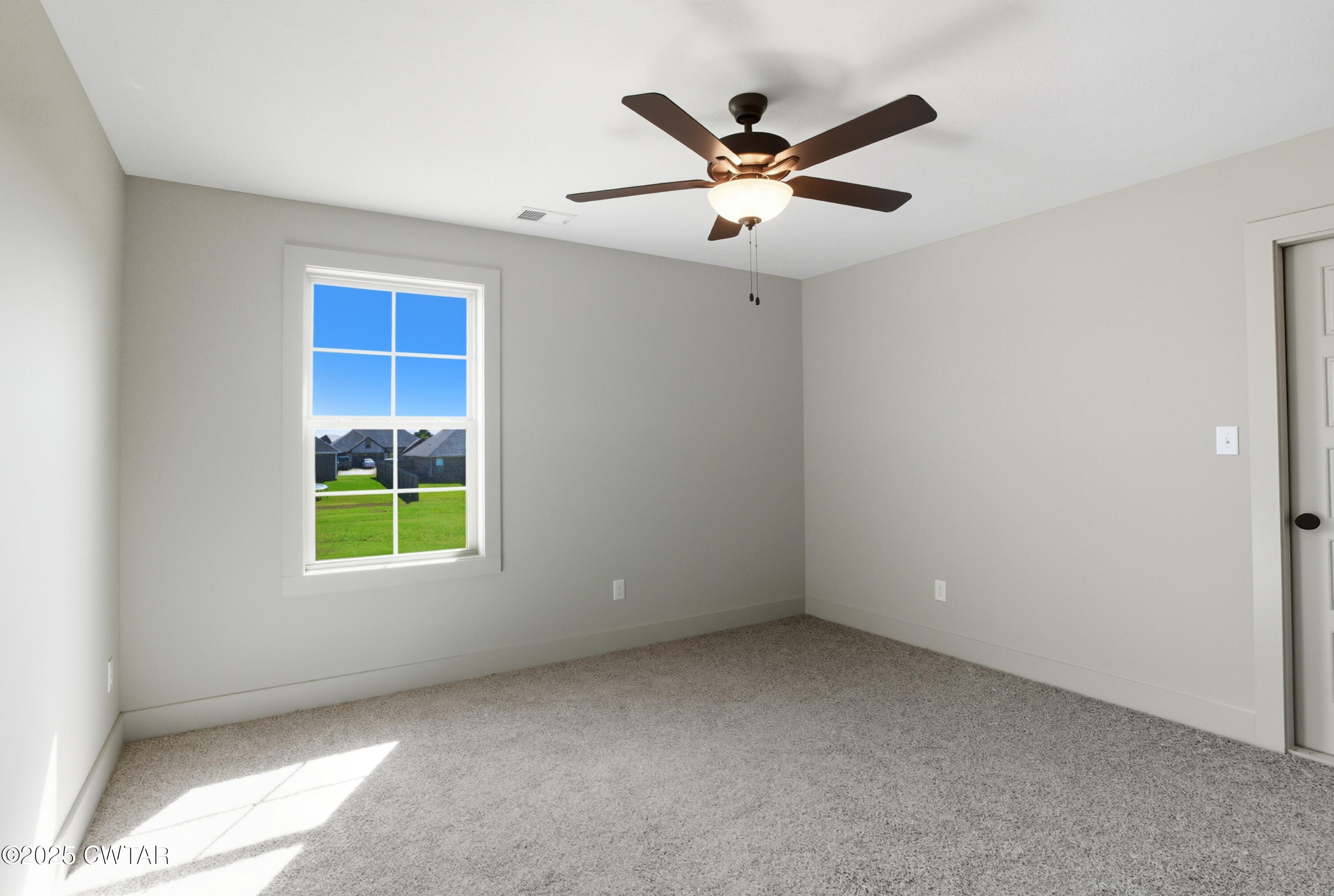 170 Daybreak Loop Medina, TN 38355 - Photo 23 of 31 an empty room with windows and fan