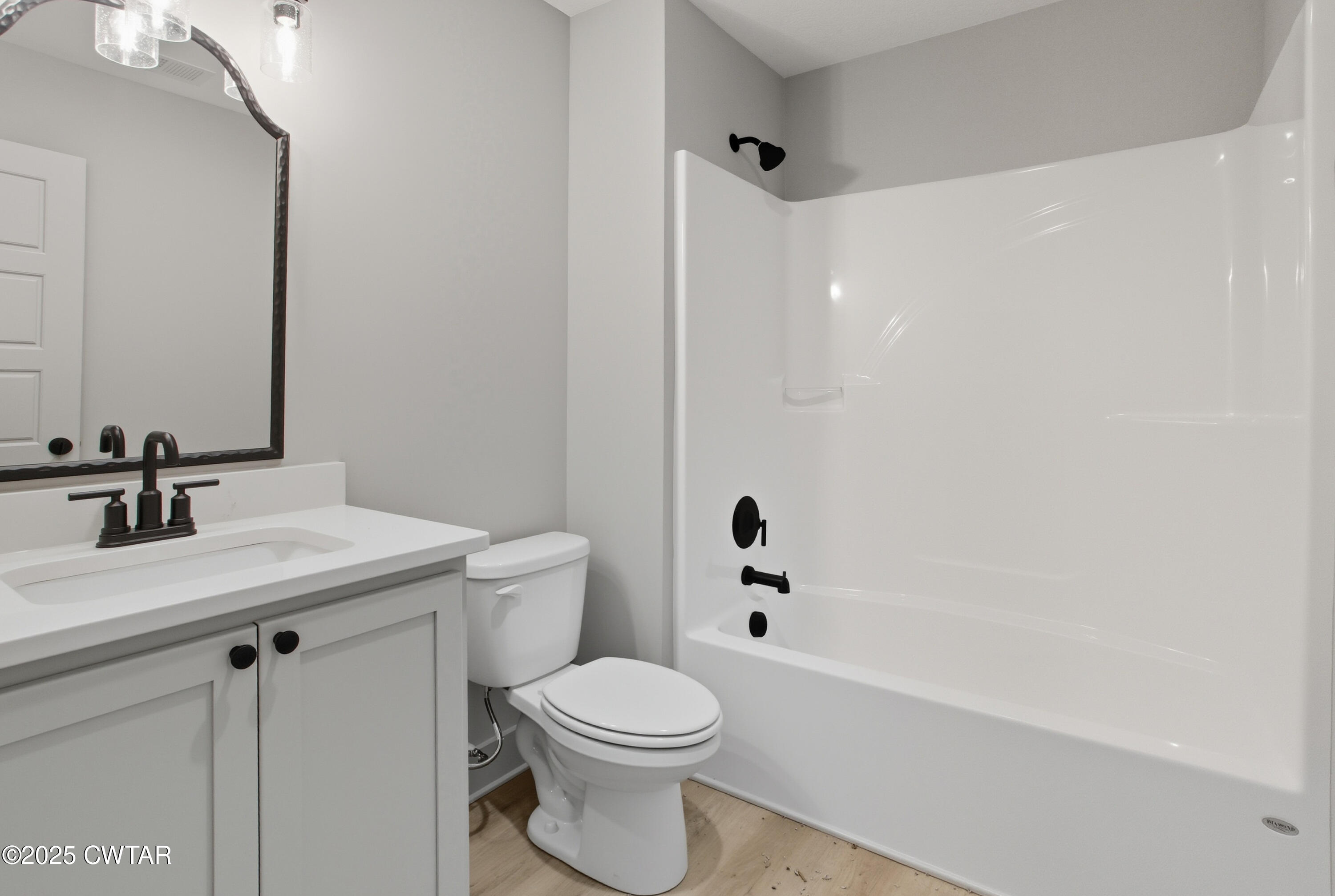 170 Daybreak Loop Medina, TN 38355 - Photo 27 of 31 a bathroom with a sink a toilet and a bathtub
