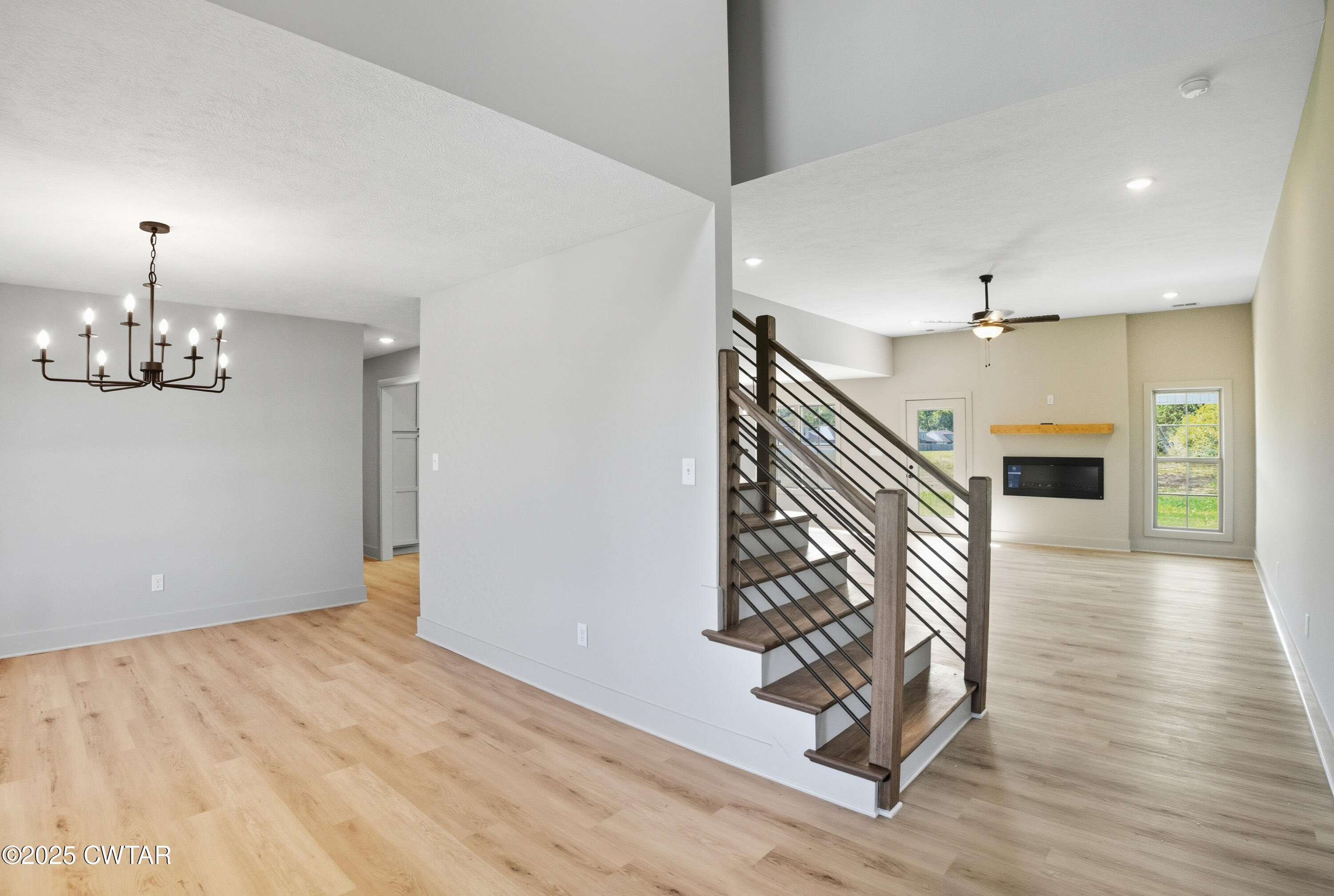 170 Daybreak Loop Medina, TN 38355 - Photo 6 of 31 wooden floor in an empty room with a window