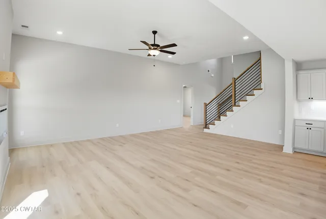 a white bath tub sitting next to a white sink