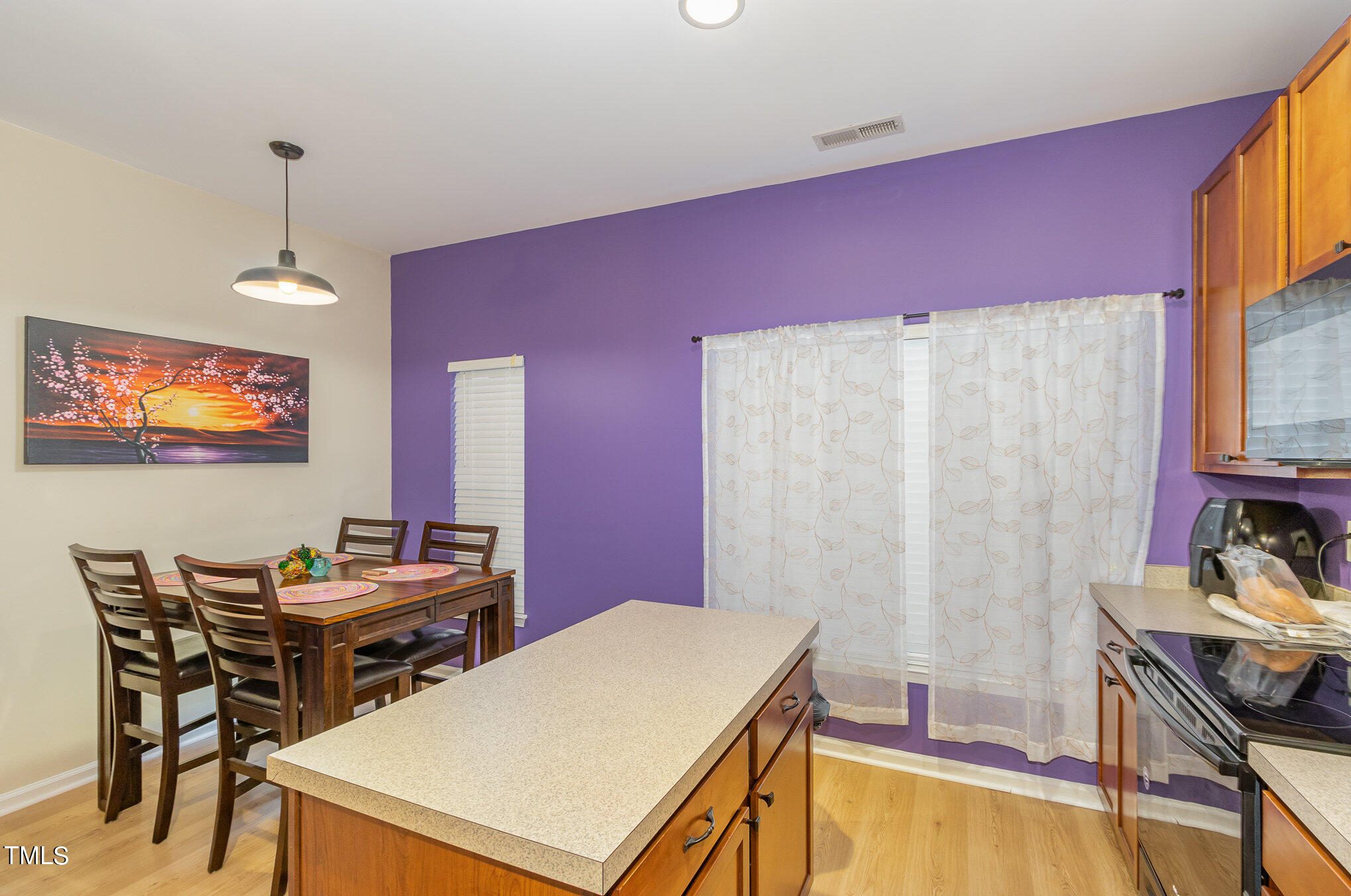 1665 Snow Mass Way Durham, NC 27713 - Photo 13 of 34 a room with furniture a flat screen tv and a lamp