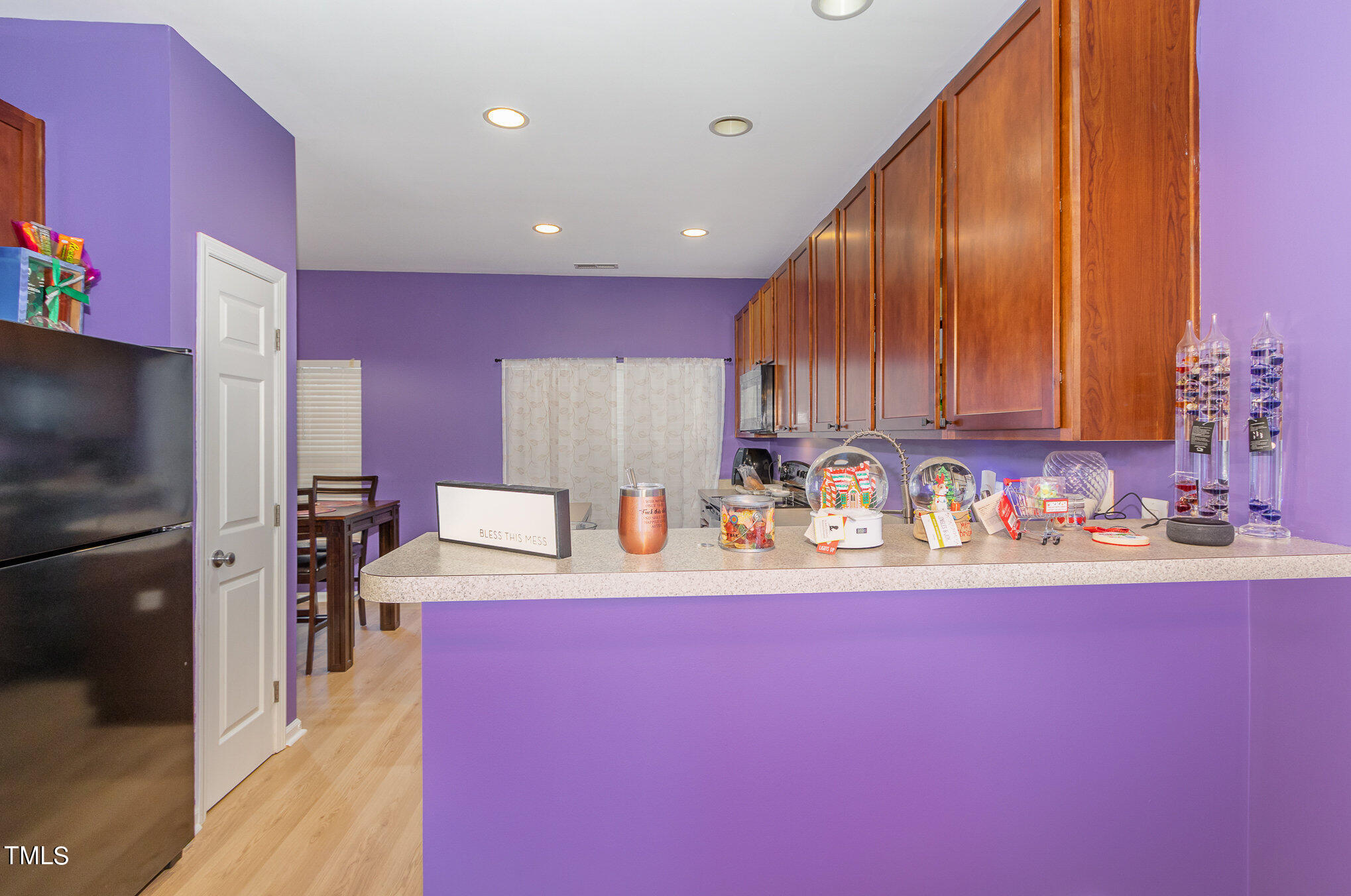 1665 Snow Mass Way Durham, NC 27713 - Photo 15 of 34 a kitchen with a sink cabinets and stainless steel appliances