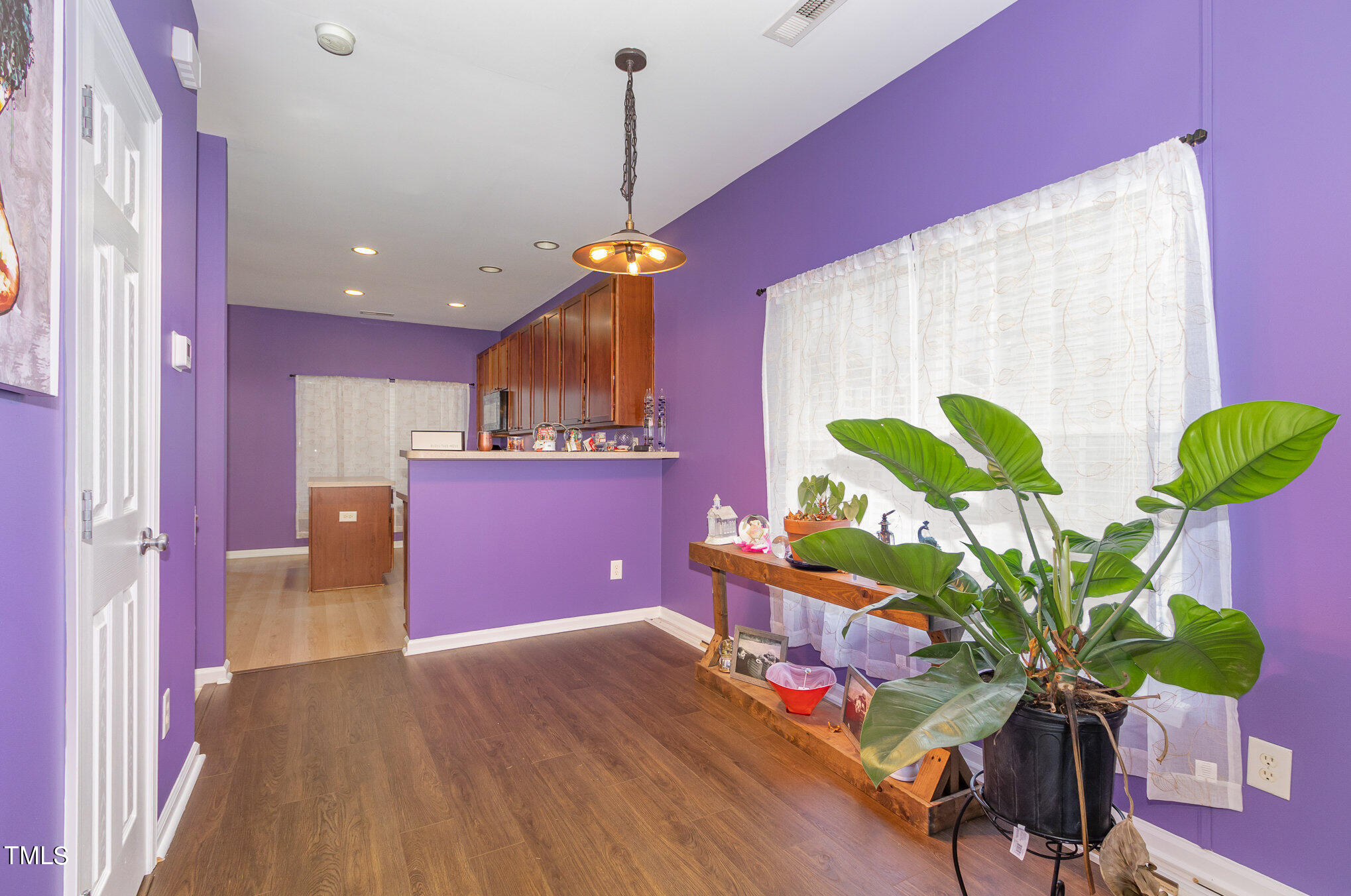 1665 Snow Mass Way Durham, NC 27713 - Photo 16 of 34 a dining room filled chandelier and wooden floor