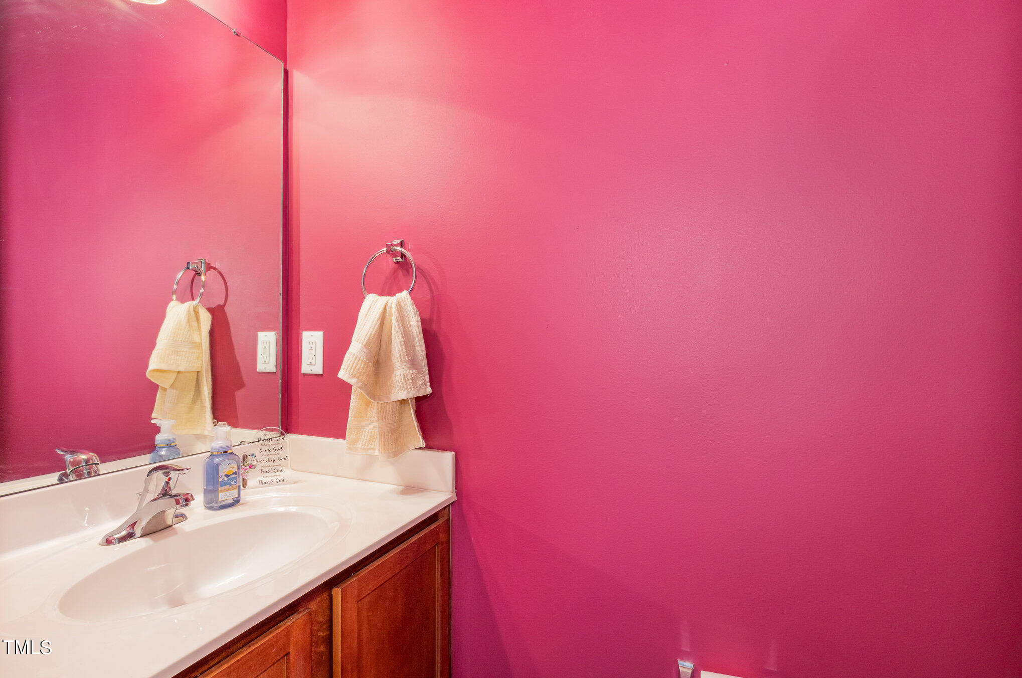 1665 Snow Mass Way Durham, NC 27713 - Photo 19 of 34 a bathroom with a sink vanity and a mirror