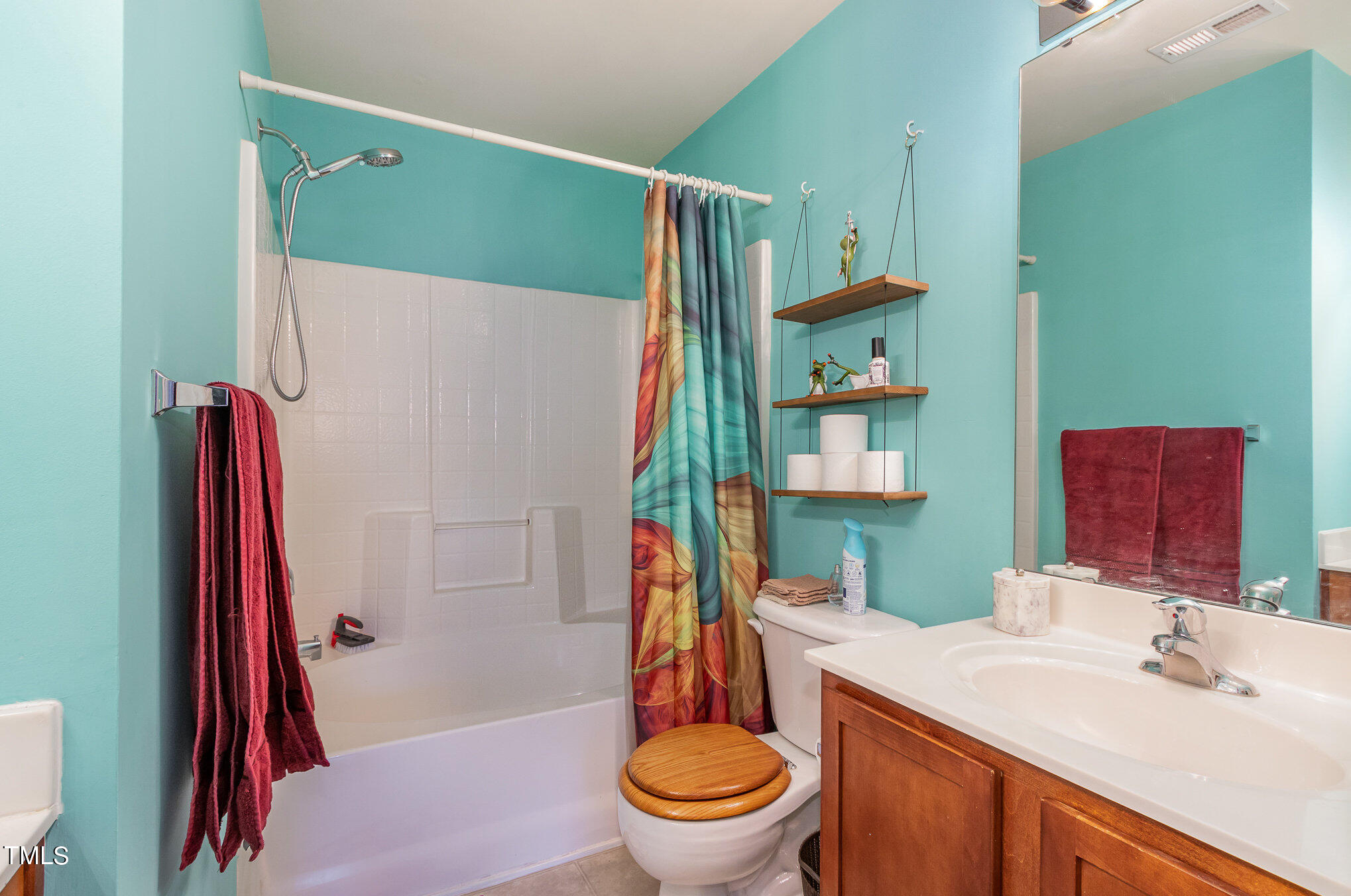 1665 Snow Mass Way Durham, NC 27713 - Photo 22 of 34 a bathroom with a sink toilet and a shower