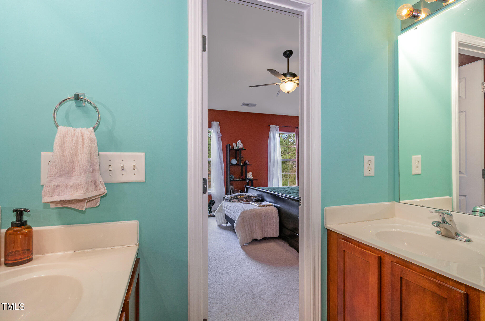1665 Snow Mass Way Durham, NC 27713 - Photo 23 of 34 a en suite bathroom with a sink and mirror