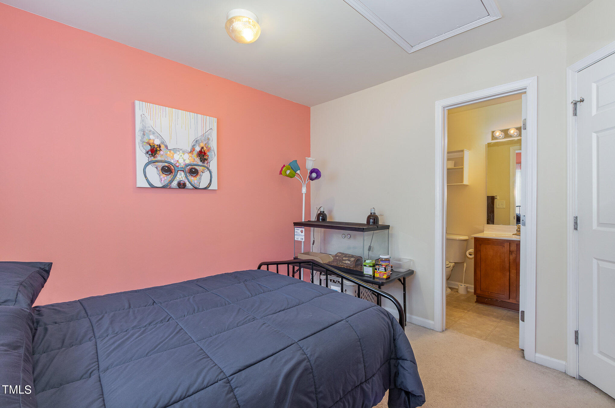 1665 Snow Mass Way Durham, NC 27713 - Photo 26 of 34 a bedroom with a bed and a view of bathroom
