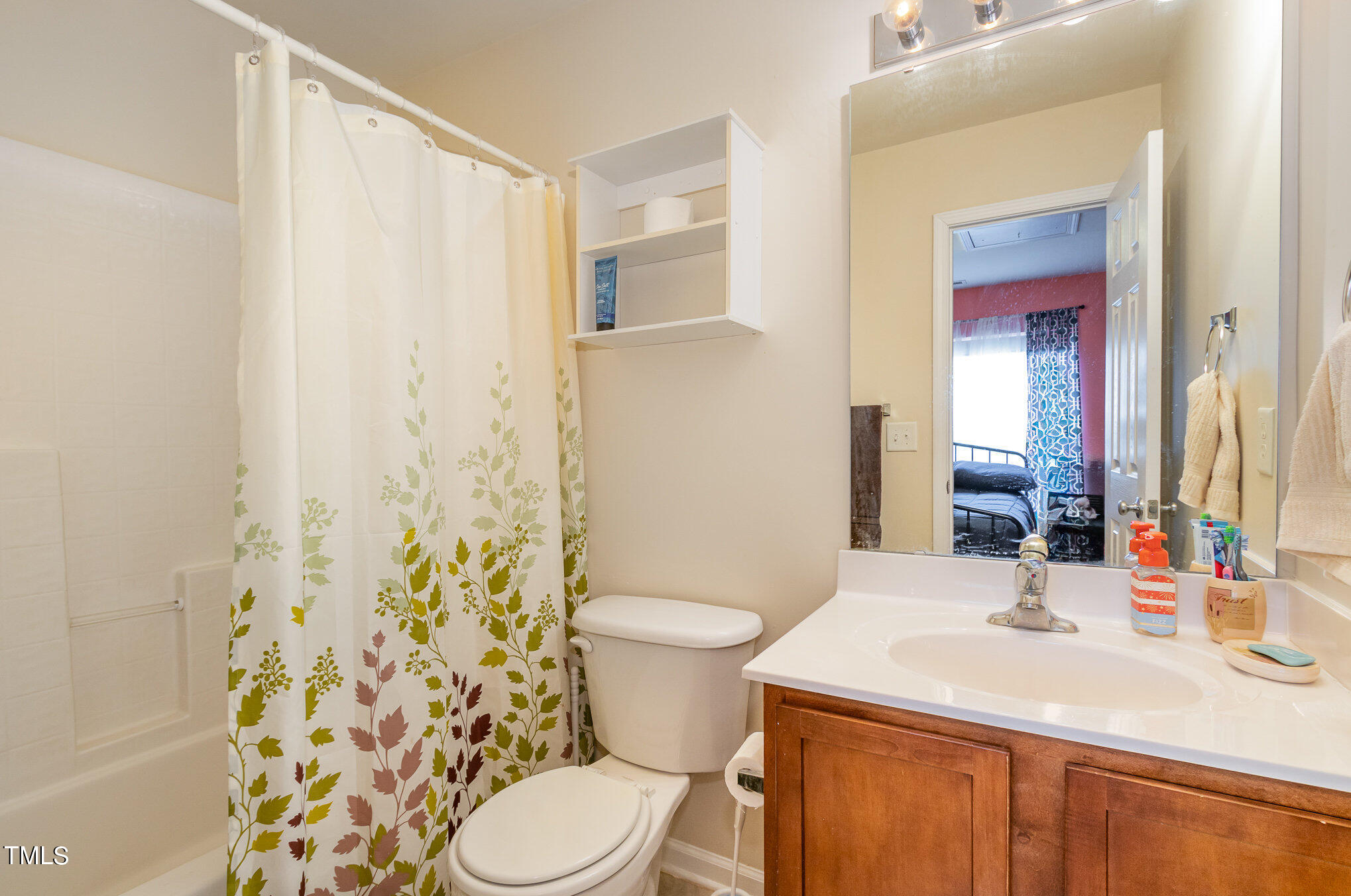 1665 Snow Mass Way Durham, NC 27713 - Photo 27 of 34 a bathroom with a sink a toilet and shower curtain