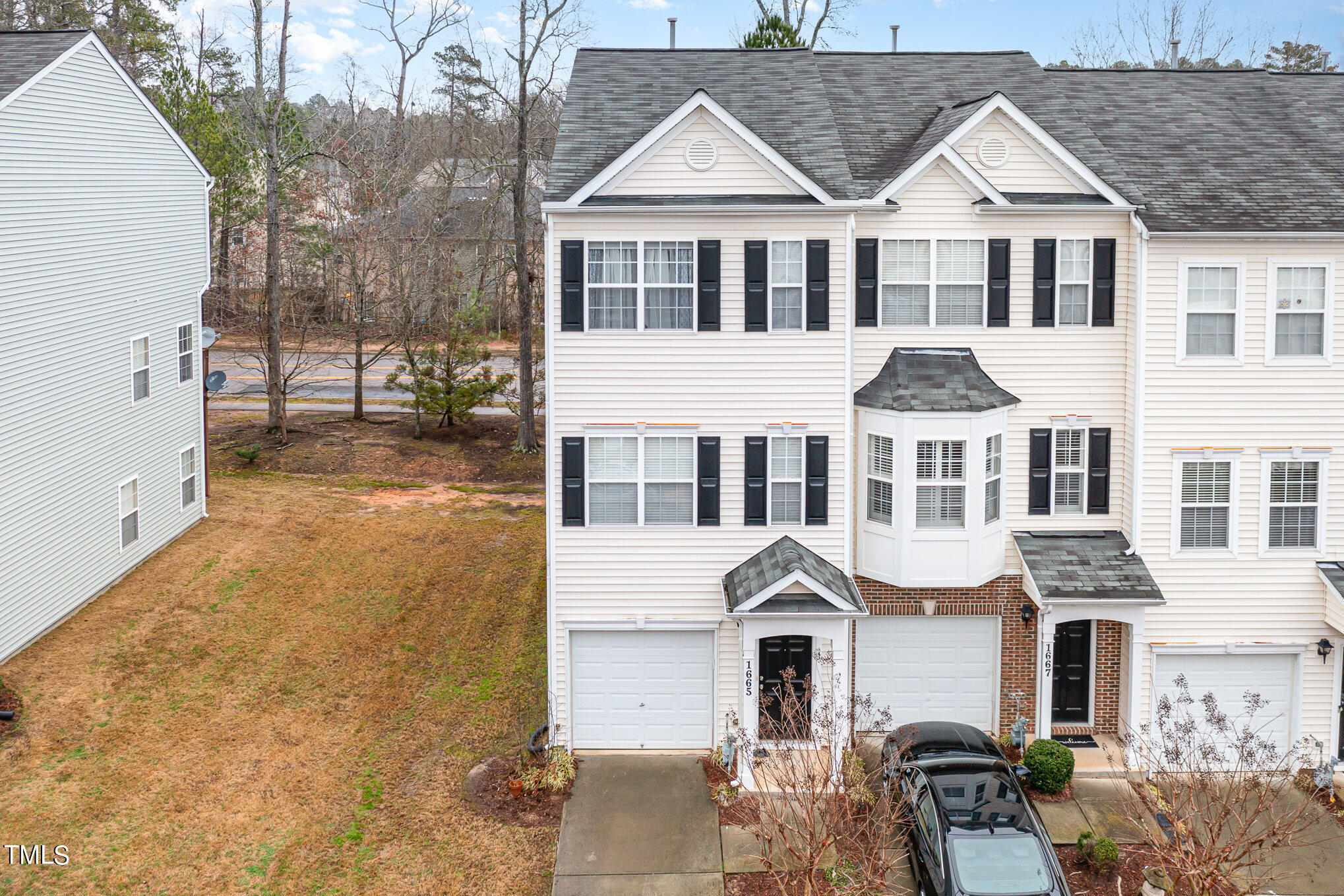 1665 Snow Mass Way Durham, NC 27713 - Photo 3 of 34 a front view of a house with a yard