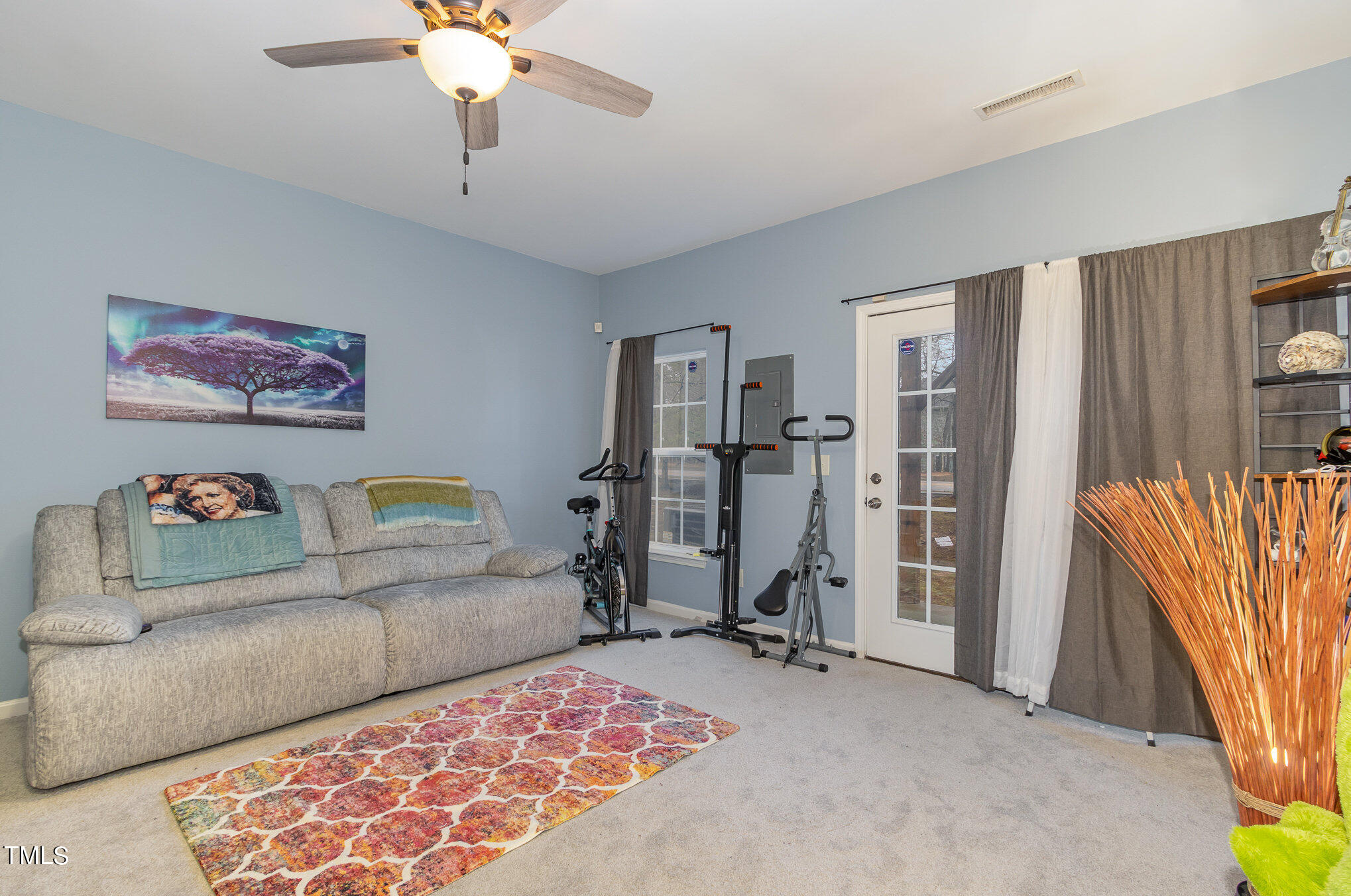 1665 Snow Mass Way Durham, NC 27713 - Photo 9 of 34 a living room with furniture and a chandelier