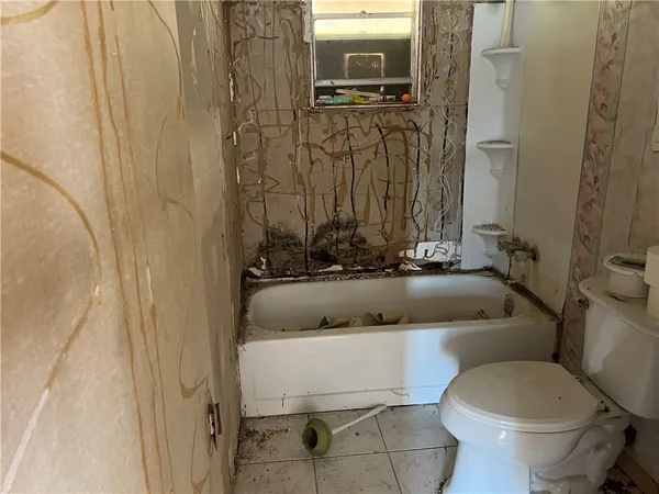 a bathroom with a toilet and a sink