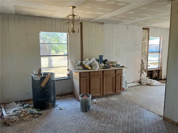 a room with gym equipment and windows