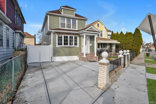 a front view of a house with glass doors