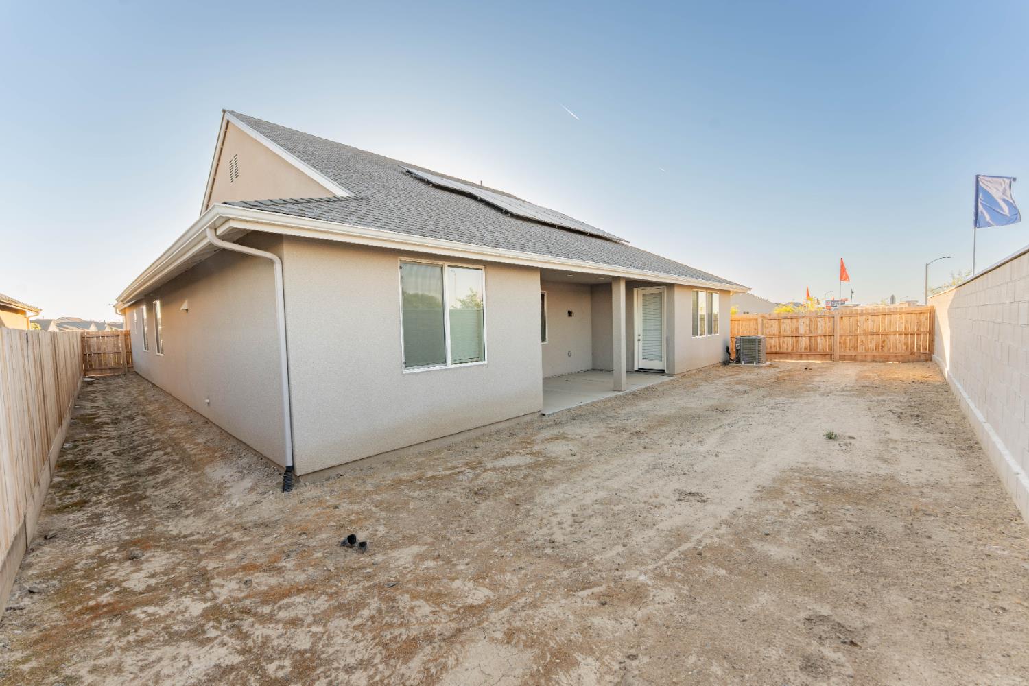 30480 Bellwood Road Visalia, CA 93291 - Photo 35 of 37 a view of a house with backyard and garage