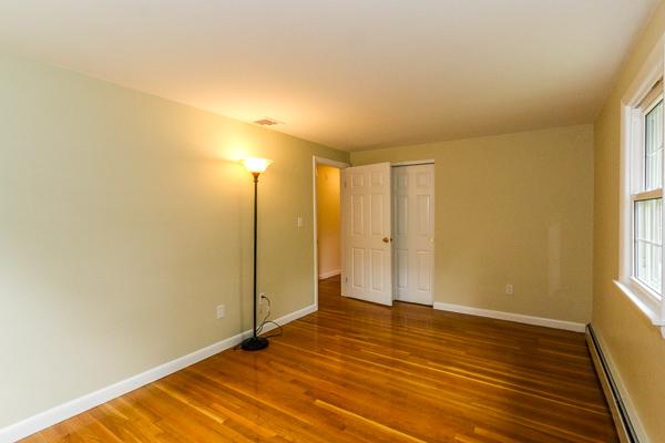 13 Scenna Road Beverly, MA 01915 - Photo 16 of 23 a view of an empty room with window and wooden floor