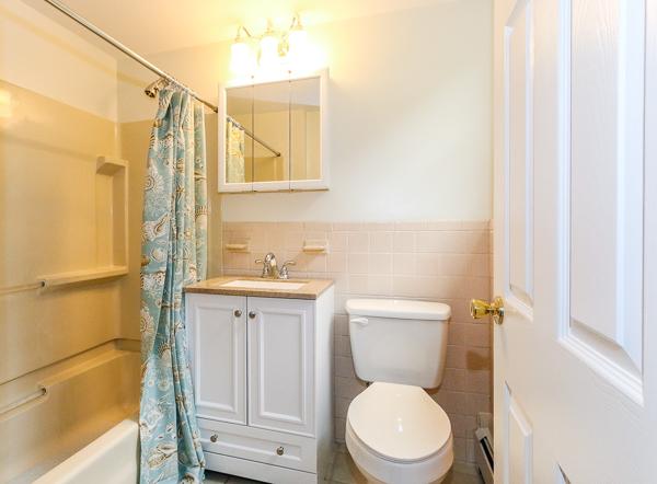 13 Scenna Road Beverly, MA 01915 - Photo 17 of 23 a bathroom with a toilet a sink and a bathtub