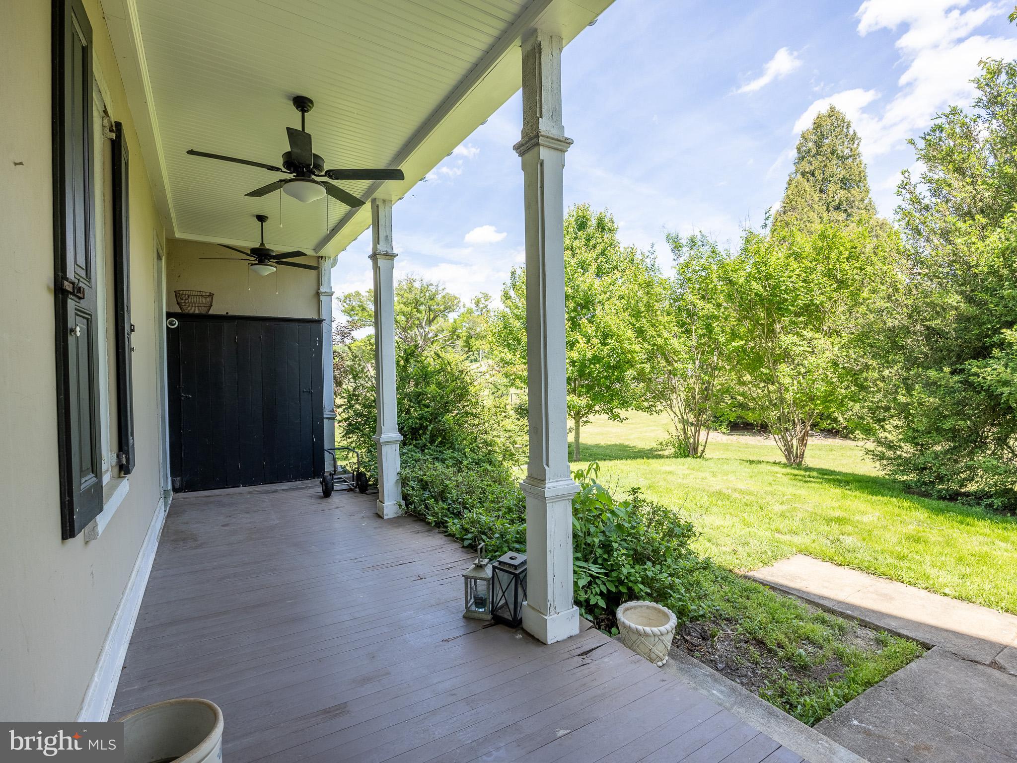 225 Niantic Road Barto, PA 19504 - Photo 19 of 82 a view of a porch with a floor to ceiling window and wooden fence