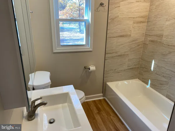 a bathroom with a sink and a bathtub