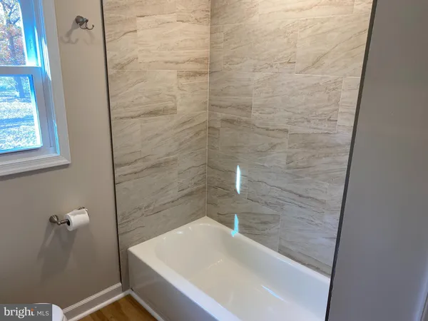 a bathroom with a sink and a shower