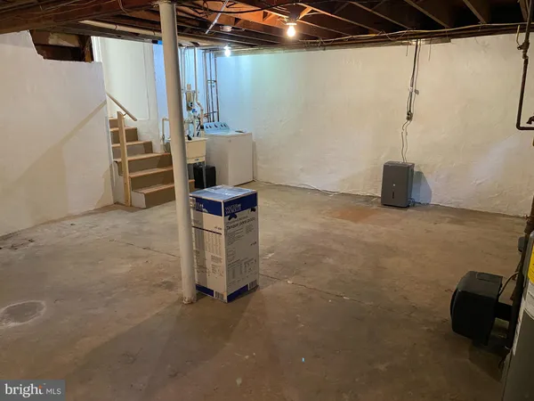 a view of a storage and utility room with stairs