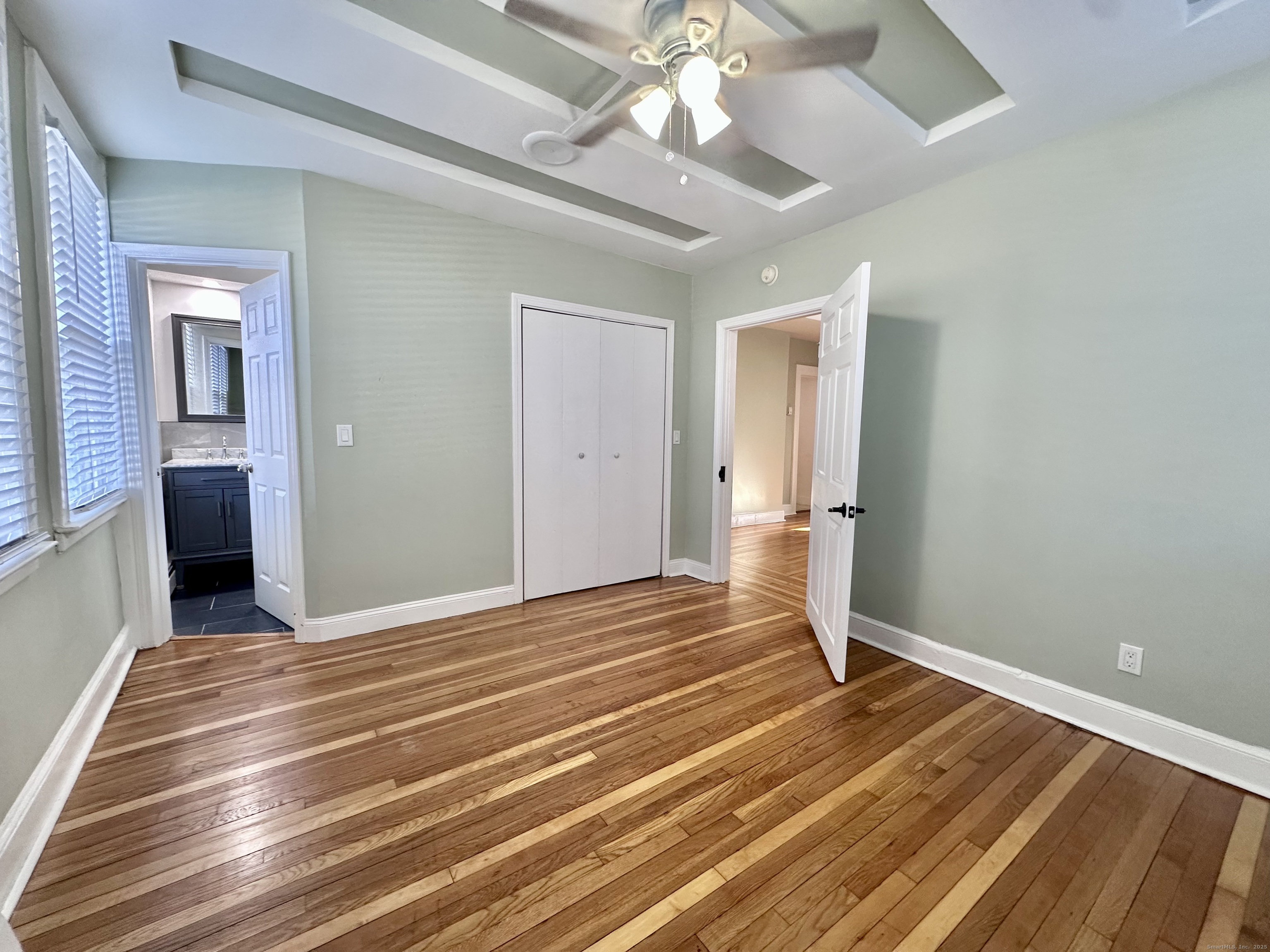 928 Townsend Avenue, Unit 1 New Haven, CT 06512 - Photo 12 of 19 a view of a room with wooden floor and ceiling fan
