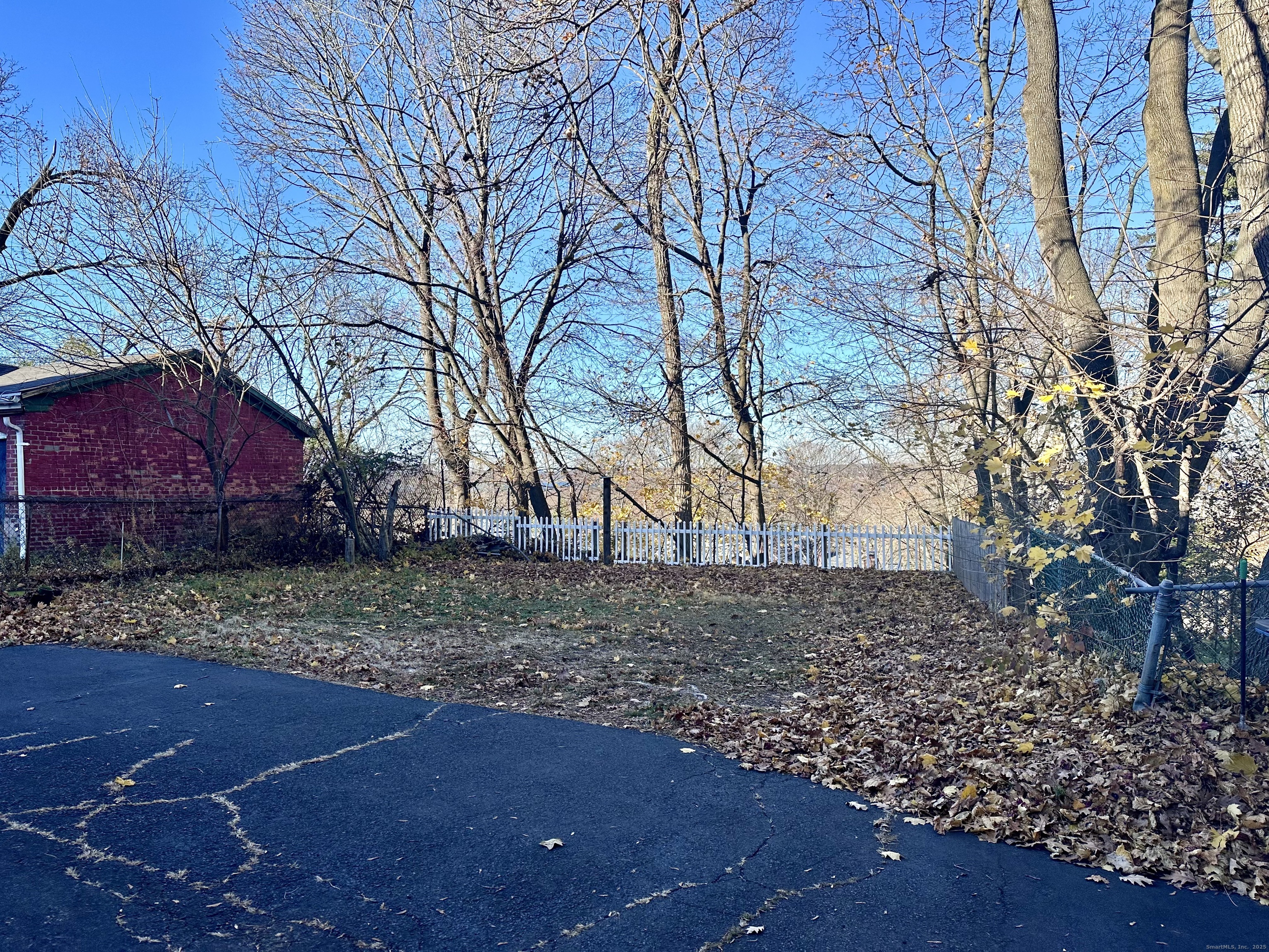 928 Townsend Avenue, Unit 1 New Haven, CT 06512 - Photo 19 of 19 a backyard of a house with lots of green space