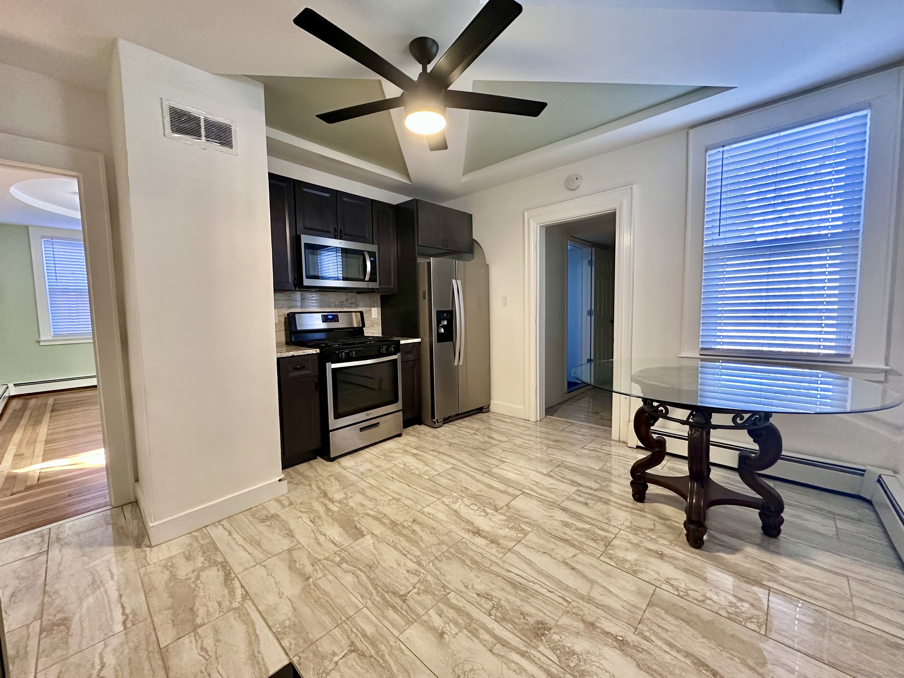 928 Townsend Avenue, Unit 1 New Haven, CT 06512 - Photo 4 of 19 a view of a workspace with furniture and wooden floor