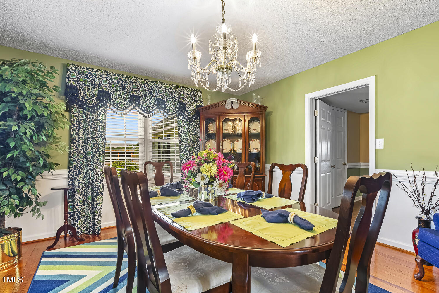 195 Williams Road Coats, NC 27521 - Photo 16 of 100 a view of a dining room with furniture and chandelier
