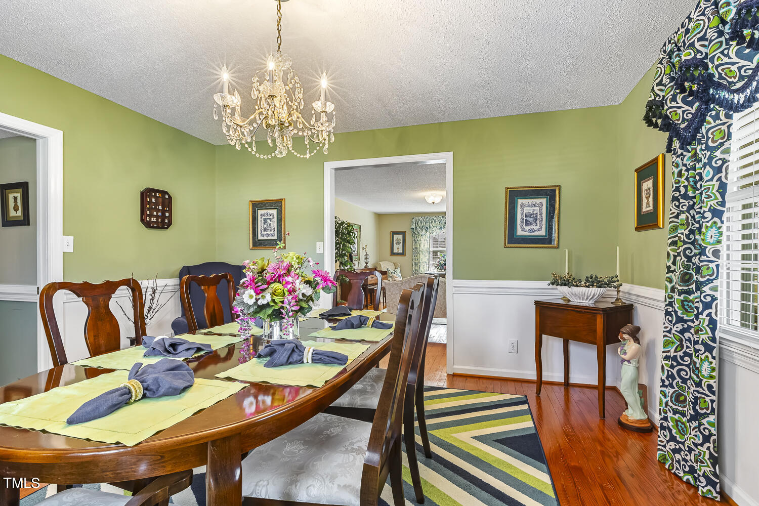 195 Williams Road Coats, NC 27521 - Photo 17 of 100 a view of a dining room with furniture and chandelier
