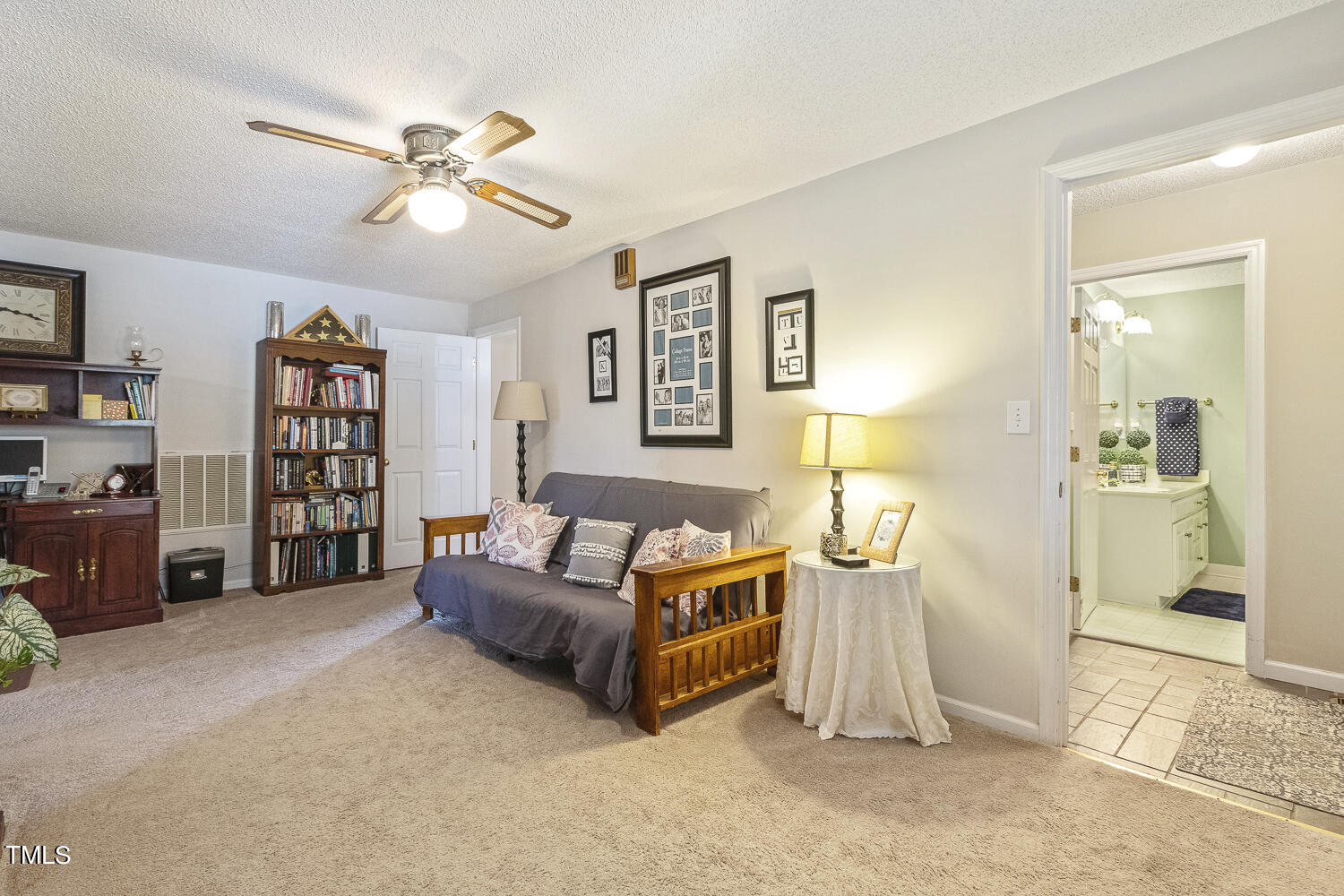 195 Williams Road Coats, NC 27521 - Photo 20 of 100 a living room with furniture and a flat screen tv