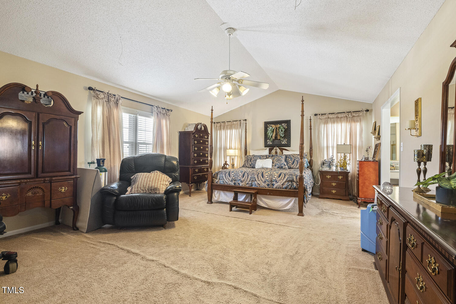 195 Williams Road Coats, NC 27521 - Photo 24 of 100 a living room with furniture a chandelier and a dining table