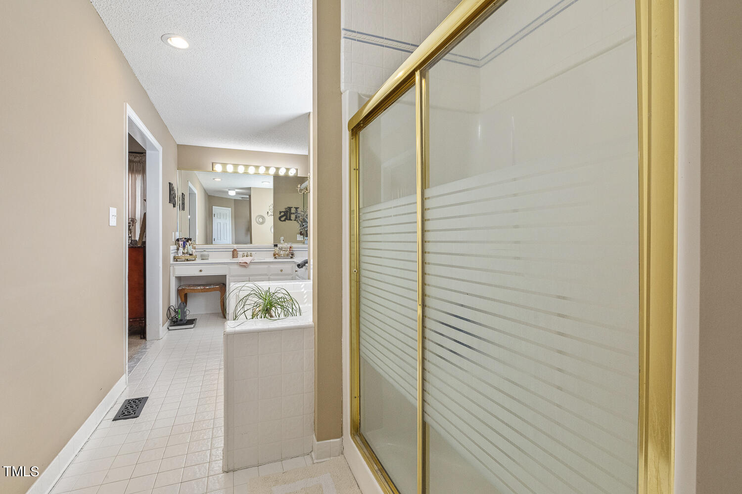 195 Williams Road Coats, NC 27521 - Photo 31 of 100 a bathroom with a glass shower door and a sink