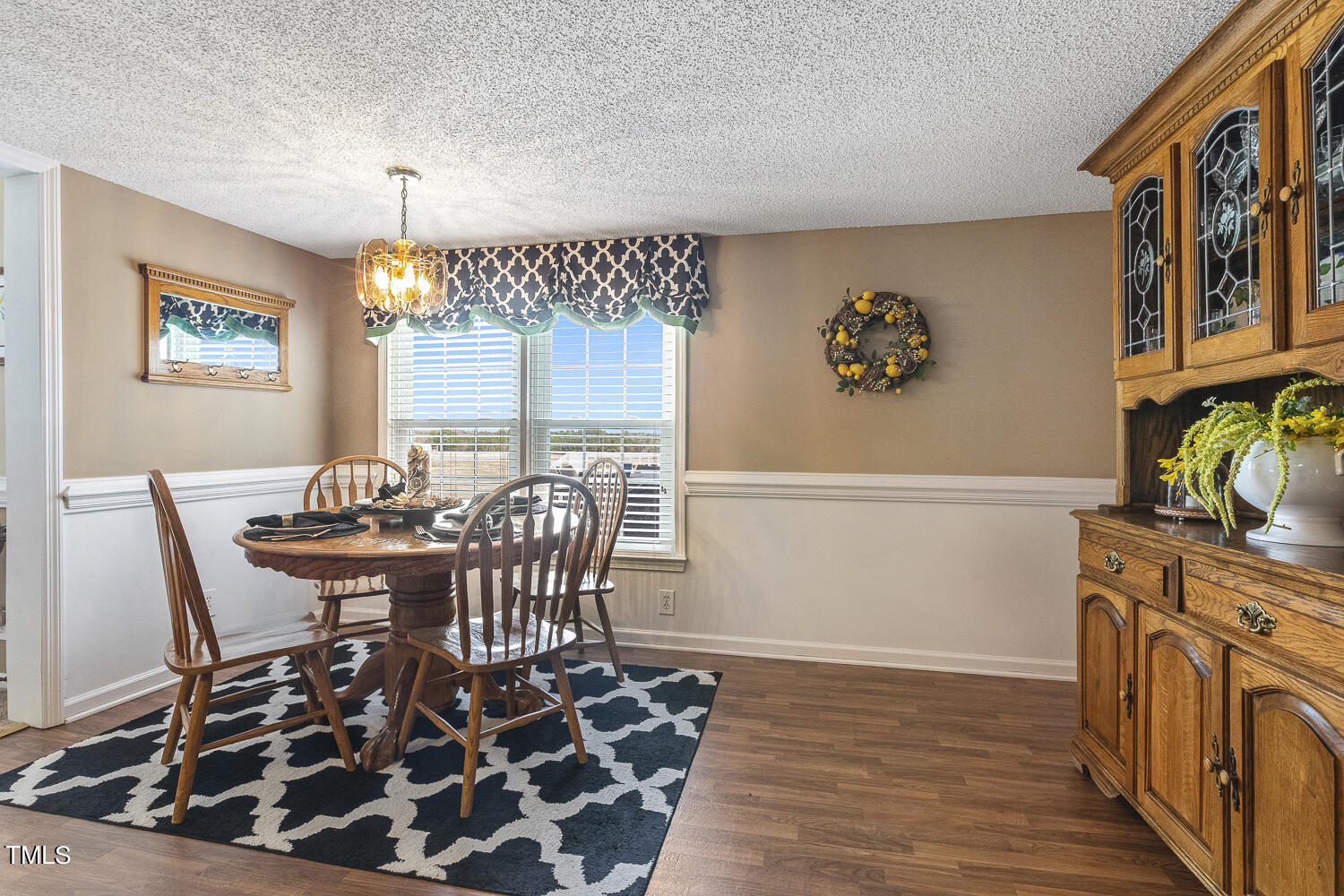 195 Williams Road Coats, NC 27521 - Photo 38 of 100 a view of a dining room with furniture and chandelier