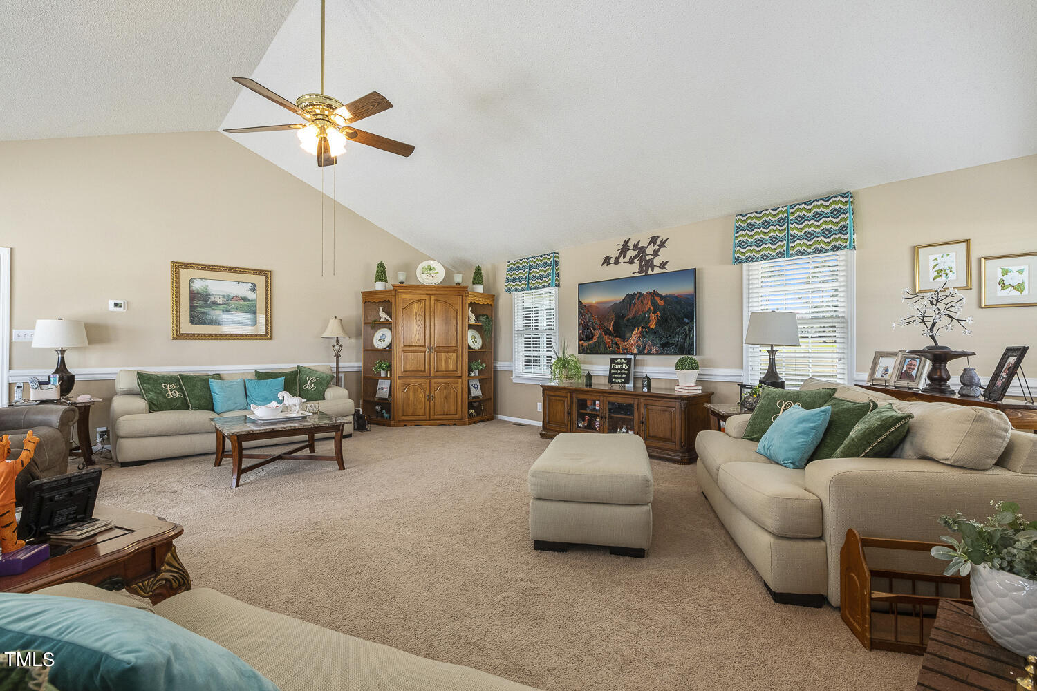 195 Williams Road Coats, NC 27521 - Photo 43 of 100 a living room with furniture and a flat screen tv