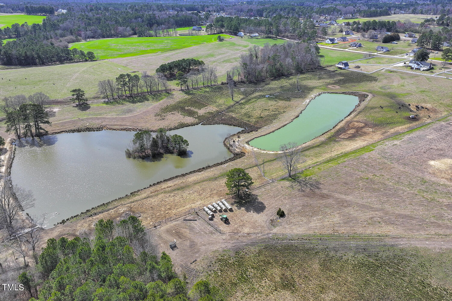 195 Williams Road Coats, NC 27521 - Photo 78 of 100 an aerial view of a house with a yard and lake